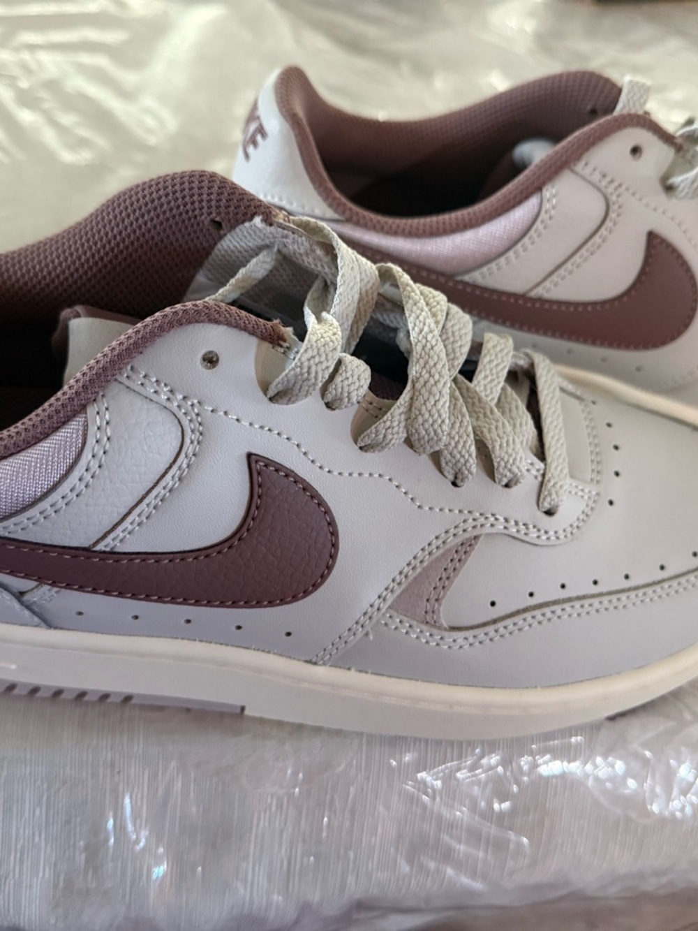 Nike Low-Top Sneakers in White with Mauve Swoosh Accents